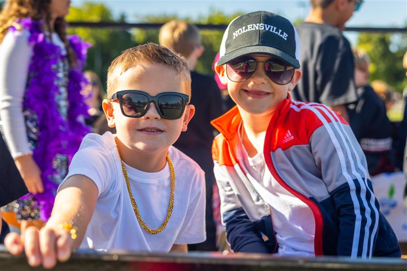 Two elementary students enjoy the Nolensville High homecoming parade